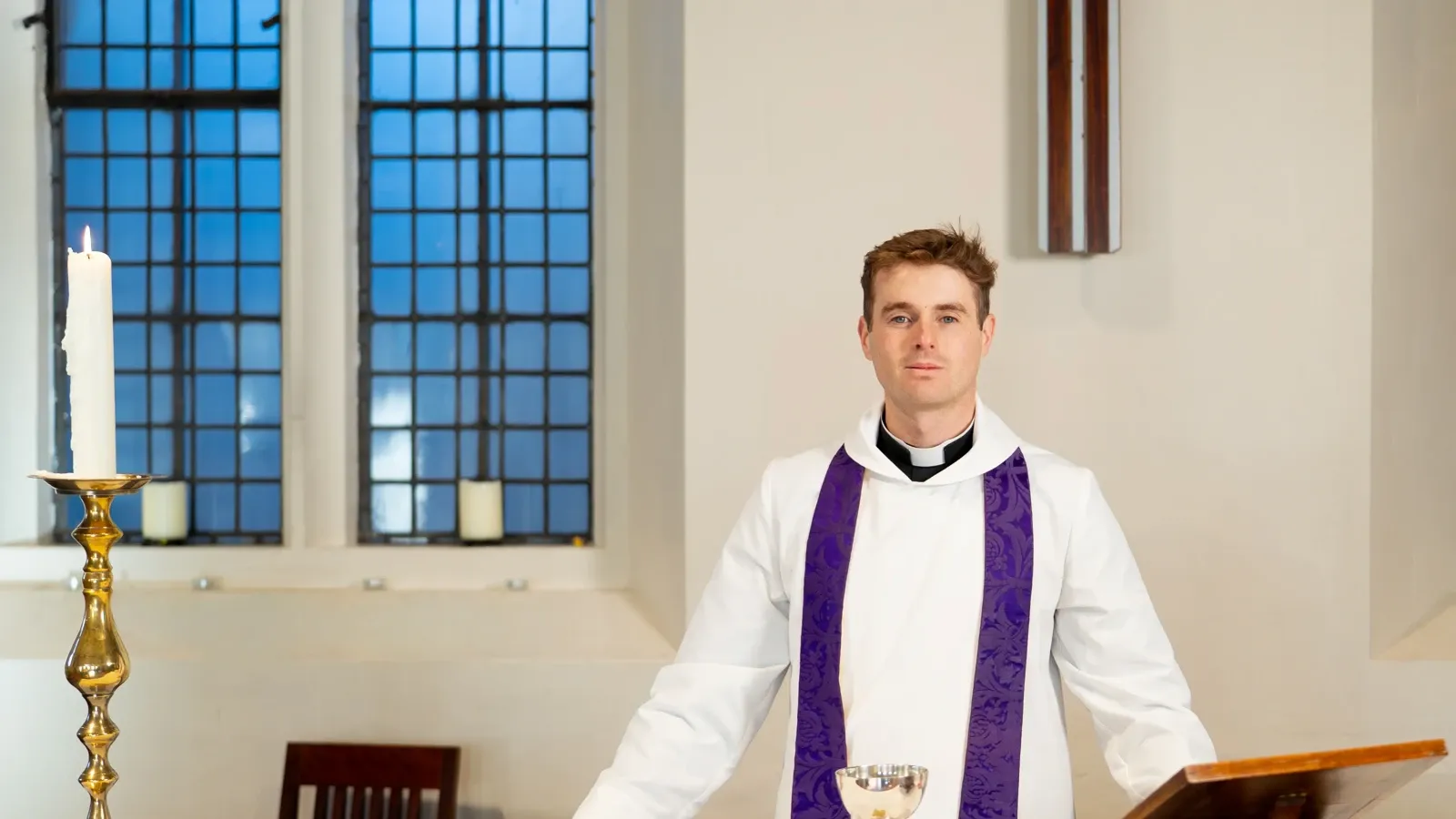 Revd Ryan Gilfeather behind the Alter